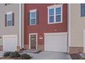 Townhome exterior featuring a red and beige facade at 445 Brier Summit Pl, Durham, NC 27703