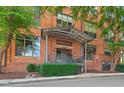 Brick building exterior with covered entryway and landscaping at 500 N Duke St # 53-307, Durham, NC 27701