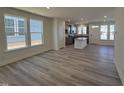 Open concept living area boasts natural light and flows seamlessly into the kitchen at 6328 Granite Quarry Dr, Raleigh, NC 27610