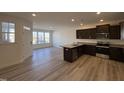 Open kitchen featuring granite countertops and stainless steel appliances at 6330 Granite Quarry Dr, Raleigh, NC 27610