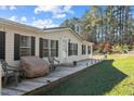 Side of the house with a deck and grill at 754 Firestone Ln, Sanford, NC 27330