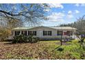 House exterior with large yard and trees at 754 Firestone Ln, Sanford, NC 27330