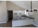 Bright, open kitchen with granite countertops and white cabinets at 104 Halifax Rd, Louisburg, NC 27549