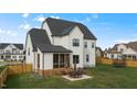 Spacious backyard with patio, screened porch, and trampoline at 1105 Duke Farm Dr, Wake Forest, NC 27587
