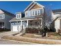 Two-story home with stone accents and a landscaped front yard at 114 Naperville Dr, Cary, NC 27519