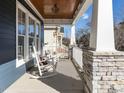Relaxing front porch with rocking chairs, perfect for enjoying the outdoors at 114 Naperville Dr, Cary, NC 27519