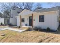 Modern white house with a stylish front porch and walkway at 2207 Edwin Ave, Durham, NC 27705