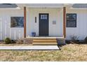 Front door entry with steps leading to a charming porch at 2207 Edwin Ave, Durham, NC 27705