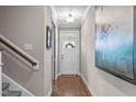 Bright entryway with hardwood floors and staircase at 2224 Madison Creek Dr, Apex, NC 27502