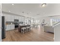 Open concept kitchen with island, stainless steel appliances, and a breakfast bar at 517 Marthas View Way, Wake Forest, NC 27587