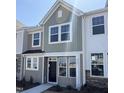 Charming townhome showcasing modern architectural details and a welcoming entrance at 6332 Granite Quarry Dr, Raleigh, NC 27610