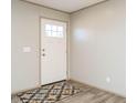 Simple entryway with a white door and patterned rug at 6567 Old Jefferson Davis Hwy, Cameron, NC 28326