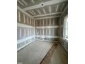 Unfinished room with wainscoting and large windows at 1401 Cottondale Ln, Wake Forest, NC 27587