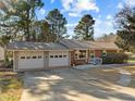 Ranch house with a two-car garage and a large front yard at 1501 Mountain View Ct, Hillsborough, NC 27278