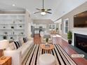 Virtually staged living room with fireplace and built-in shelves at 1813 Ferrell Meadows Dr, Zebulon, NC 27597