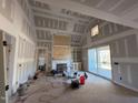 Spacious living room with high ceilings and built-in shelving at 20 Tamaran Ct, Spring Hope, NC 27882