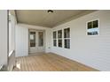 Spacious back porch with wood flooring, offering a private outdoor living space at 224 Wash Hollow Dr, Wendell, NC 27591