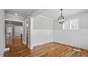 Spacious dining area with hardwood floors, modern lighting and ample room for entertaining at 224 Wash Hollow Dr, Wendell, NC 27591