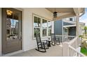 Inviting front porch with rocking chairs, offering a relaxing outdoor space at 224 Wash Hollow Dr, Wendell, NC 27591