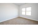 Simple bedroom with carpeted floor and large window at 40 Northwood Dr, Fuquay Varina, NC 27526