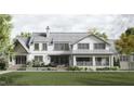 Back view of a charming house showcasing a large backyard and patio at 432 Firefly Overlook, Pittsboro, NC 27312