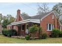 Brick house with a porch, showcasing its side elevation at 601 Rose St, Rocky Mount, NC 27801