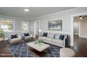 Bright living room featuring neutral walls, dark wood floors, and ample seating at 601 Rose St, Rocky Mount, NC 27801