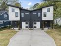 Two modern homes with attached garages and a shared driveway at 707 Colleton Rd, Raleigh, NC 27610