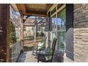 Relaxing front porch with rocking chairs and view of backyard at 7112 Hasentree Way, Wake Forest, NC 27587