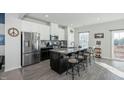 Island kitchen with granite countertops and stainless steel appliances at 104 Ridgeline Ct, Durham, NC 27703