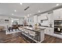 Spacious kitchen with granite countertops, white cabinets, and stainless steel appliances at 1109 Timbercut Dr, Durham, NC 27703