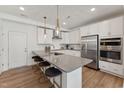 Modern kitchen with gray countertops, stainless steel appliances, and island at 1245 S Blount Street # 101, Raleigh, NC 27601