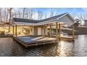Private boathouse with floating dock on calm lake at 261 Willifords Pt Dr, Roxboro, NC 27574