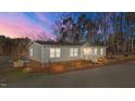 Lakefront home with landscaped yard and private dock at 261 Willifords Pt Dr, Roxboro, NC 27574