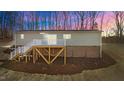 Elevated deck and stairs leading to a waterfront home at 261 Willifords Pt Dr, Roxboro, NC 27574