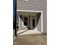 Covered back porch with stylish door and window offering a cozy outdoor retreat at 2405 Englemann Dr # 121, Apex, NC 27502