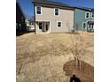Spacious backyard ready for landscaping, perfect for outdoor activities and entertaining guests at 2405 Englemann Dr # 121, Apex, NC 27502