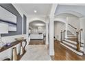 Elegant entryway with hardwood floors, high ceilings, and views to the living room and staircase at 2500 Shadow Hills Ct Ct, Raleigh, NC 27612