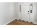 Bright entryway with hardwood floors and white door at 31 Burford Way, Angier, NC 27501