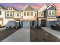 Two story townhome with attached garage and landscaped yard at 31 Burford Way, Angier, NC 27501