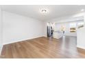 Open living room with hardwood floors and kitchen views at 31 Burford Way, Angier, NC 27501