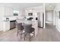 Modern kitchen with white cabinets, granite countertops, and an island at 341 Broomside Ave, Raleigh, NC 27603