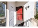 Condo entrance with red door and screen door at 514 New Kent Pl, Cary, NC 27511