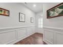 Bright and airy entryway with hardwood floors and wainscoting at 524 Brunello Dr, Wake Forest, NC 27587