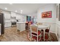 Modern kitchen with island, stainless steel appliances, and white cabinets at 524 Brunello Dr, Wake Forest, NC 27587