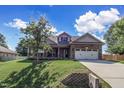 Two-story house with front yard and driveway at 151 Crosscreek Ln, Angier, NC 27501