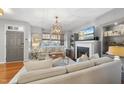 Light-filled living room with fireplace and comfortable seating at 2605 Cloud Mist Cir, Raleigh, NC 27614