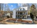 Beautiful two-story home with a modern design, balconies, and a professionally landscaped front yard at 3304 Cheswick Dr, Raleigh, NC 27609
