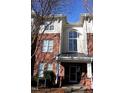 Attractive building entrance with large windows and brick facade at 331 Providence Glen Dr, Chapel Hill, NC 27514