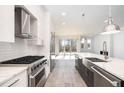 Modern kitchen with stainless steel appliances and marble countertops at 4015 Southpoint Lndg Way, Durham, NC 27707
